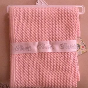 Light pink cable knit blanket